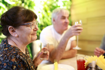 Elderly couple with beverages