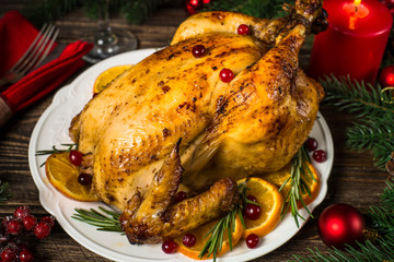 Chrismas chicken baked with cranberry, orange and rosemary. Christmas dinner.