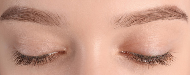 Closeup view of beautiful young woman with natural eyelashes