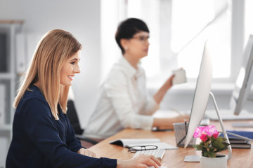 Fototapeta premium Young women working in office. Finance trading