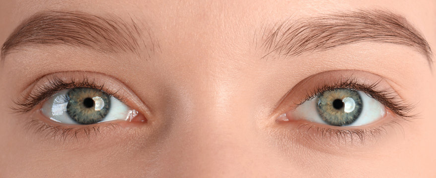 Closeup view of beautiful young woman with natural eyelashes