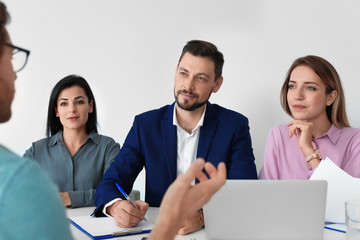Human resources commission conducting job interview with applicant in office