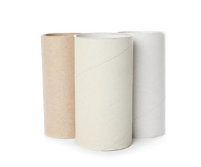 Empty toilet paper rolls on white background