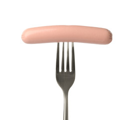 Fork with tasty cooked sausage on white background. Meat product