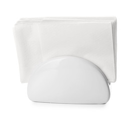 Ceramic napkin holder with paper serviettes on white background