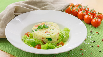 Salad with fresh vegetables in a white plate