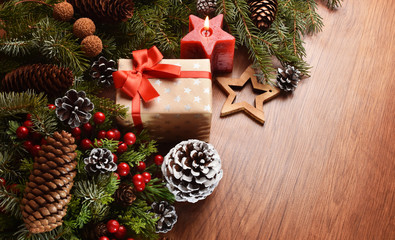 Fototapeta na wymiar Christmas present with decorations on wooden desk