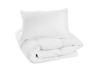 Fototapeta na wymiar Clean blanket and pillow on white background