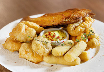 Croutons, cheese and sauce, beer snack