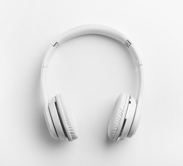 Stylish modern headphones with earmuffs on white background