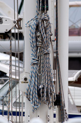 ropes tied to the main mast of a yacht