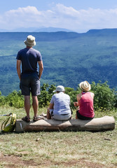Tourists relaxing  on mountain, alpine view. North Caucasus, Krasnodar region, Russia
