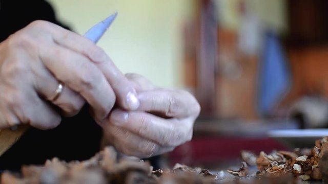 Breaking and cleaning walnuts with a hands