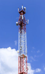 Communications tower  complete with various antennas and microwave and satellite dishes