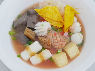 Close up of noodle in pink broth ( Yentafo ) - delicious and healthy street food in Thailand