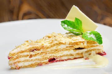 Sweet dessert with berries and herbs on a plate