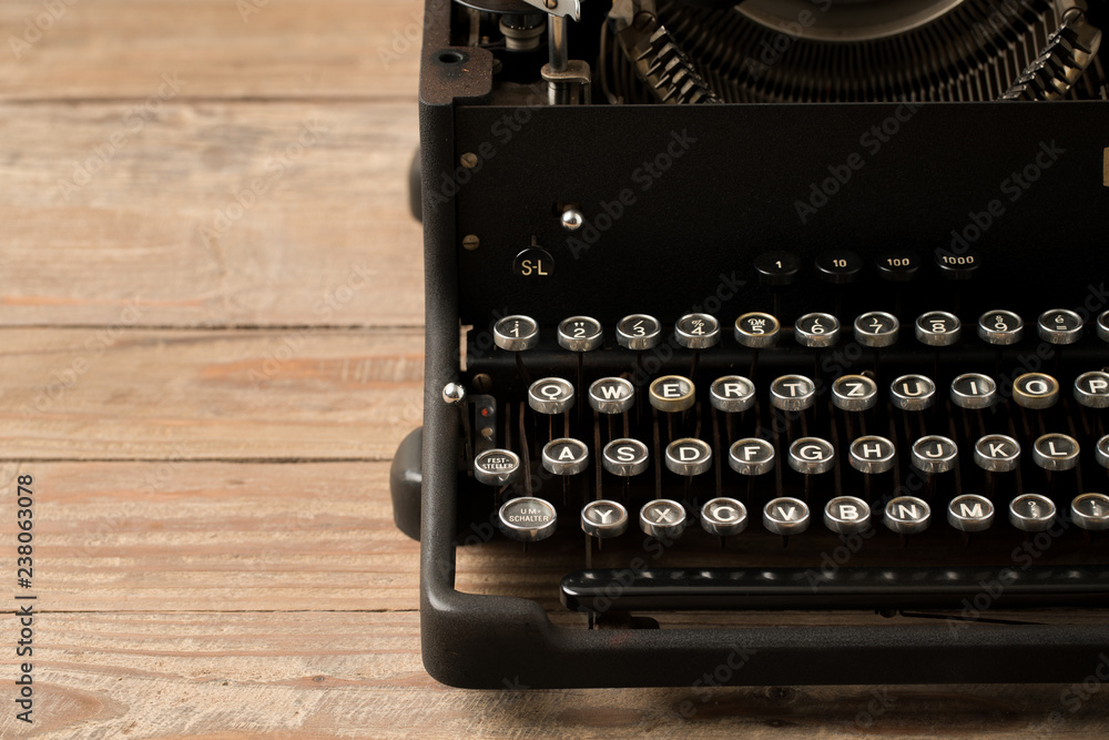 Poster top view of retro style typewriter in studio