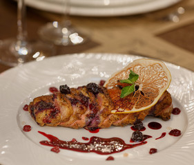 Dinner at the restaurant, dish and wine on the table