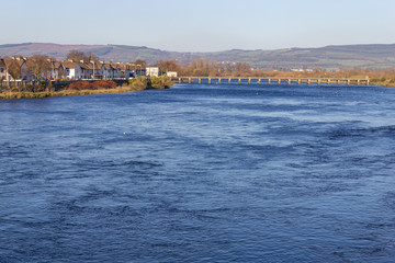 Stone bridge and houses at Shannon river