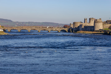 Castle, stone bridge and Shannon river
