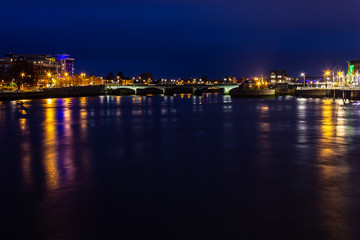 Fototapeta na wymiar City lights at Shannon river