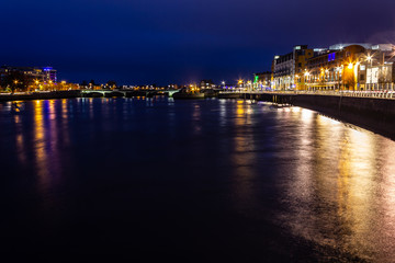 Fototapeta na wymiar City lights at Shannon river