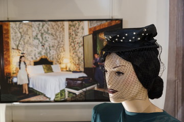 Mannequin's head in a black veil hat
