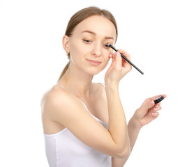 Fototapeta premium Beautiful woman beauty fashion eyeshadow brush in hand on white background isolation