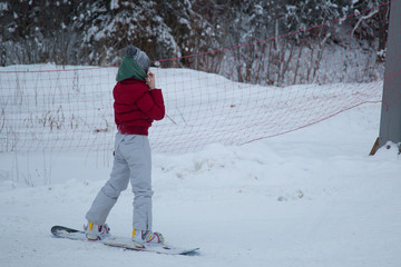 snowboarder rides a snowboard