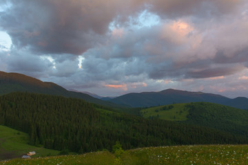 Sunrise in the mountains in the summer.