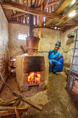 Fototapeta na wymiar Man preparing plum brandy