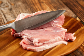 Pork leg and chef's knife