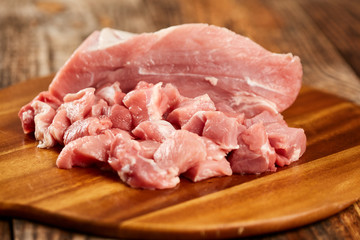 Sliced pork on a wooden board