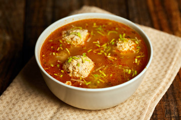 Mexican meatballs soup on a wooden board