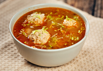 Mexican meatballs soup on a wooden board
