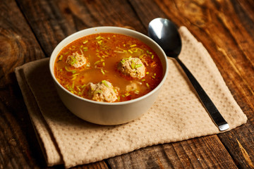 Mexican meatballs soup on a wooden board