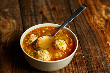 Mexican meatballs soup on a wooden board