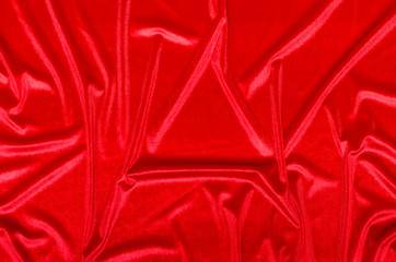 Crumpled red velvet cloth texture background.