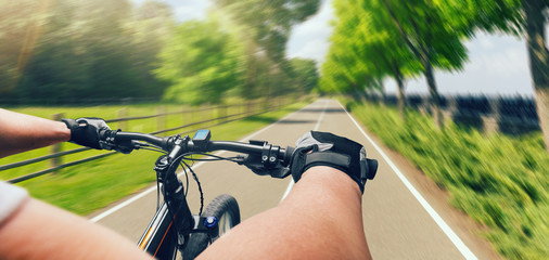 Man riding on bicycle, fast speed, aging effect