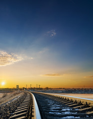 bright orange sunset over railroad closeup