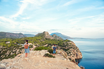 Fototapeta premium Young beautiful girl traveling along the coast of the Mediterranean Sea.