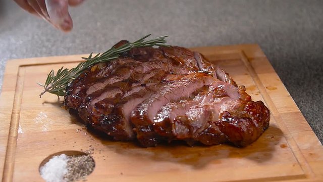 Cooking concept. Grilled marinated beef flank steak on wooden board