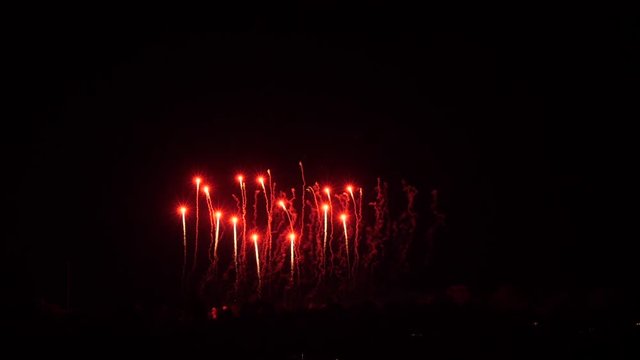 Slow motion fireworks show, red dots, big balls, white flowers