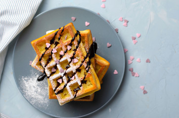 Belgian Waffles with Chocolate Sauce and Sugar Heart Sprinkles