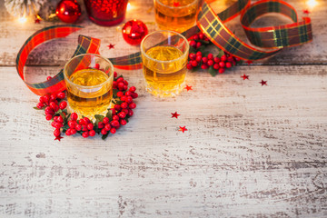 Whiskey, brandy or liquor shot and Christmas decorations