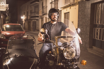 Young man driving sidecar in the street
