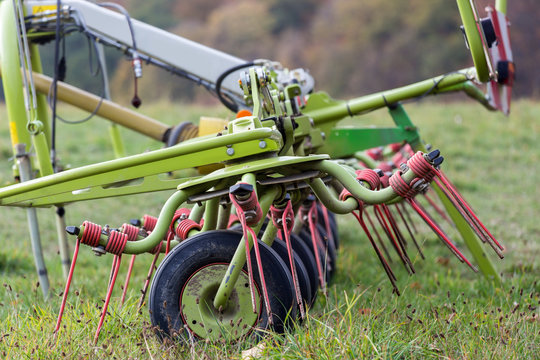 farming rotary tedder on a meadow