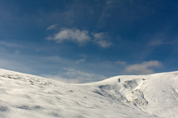 The mountain ridge is covered with snow