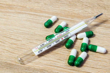 Medical diagnosis or doctor prescription mockup. Syringe, blank page notepad, bandage, tablets,...