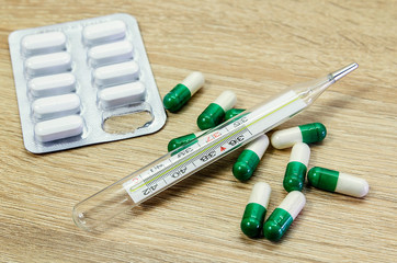 Medical diagnosis or doctor prescription mockup. Syringe, blank page notepad, bandage, tablets,...
